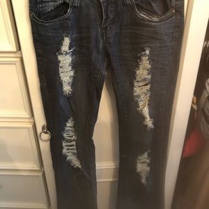 Distressed jeans with ripped front